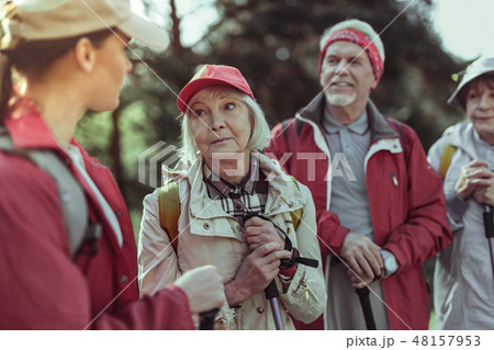 Emotional elderly woman listening to the hiking guide 48157953