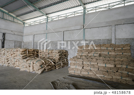 Hemp sacks containing rice in warehouse Hemp sacks containing rice in warehouse 48158678