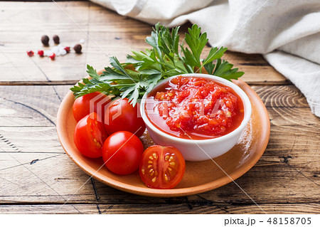 Tomato sauce pasta in a bowl and fresh tomatoes Tomato sauce pasta in a bowl and fresh tomatoes 48158705
