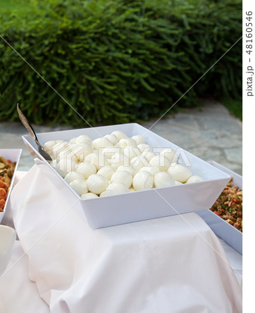 Serving dish of mozzarella nuggets 48160546