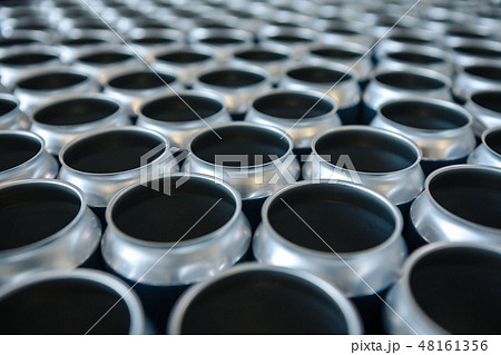 Empty aluminum cans without lids and without etiquette in stock. Close-up Empty aluminum cans without lids and without etiquette in stock. Close-up 48161356