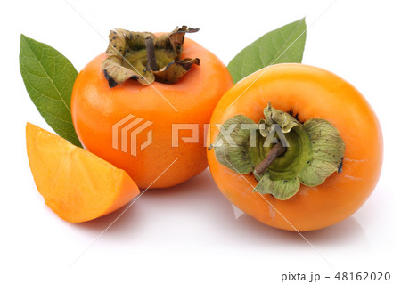 Persimmon fruit with slice and leaf isolated Persimmon fruit with slice and leaf isolated 48162020