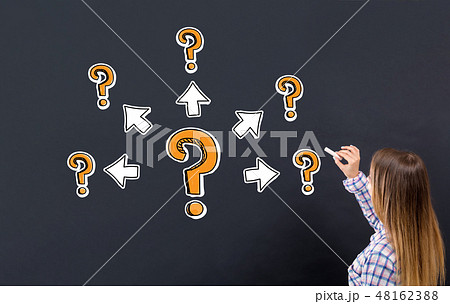 Big and small question marks with arrows with young woman Big and small question marks with arrows with young woman 48162388