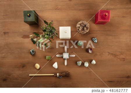 Green Magic. An overhead photo of a Wicca altar with candles, crystal stones, and Norse runes, with 48162777