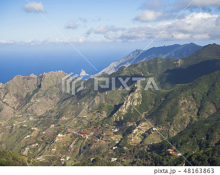 view point Amogoje, green hills with rock in the sea El Draguillo in anaga mountain, tenerife canary 48163863
