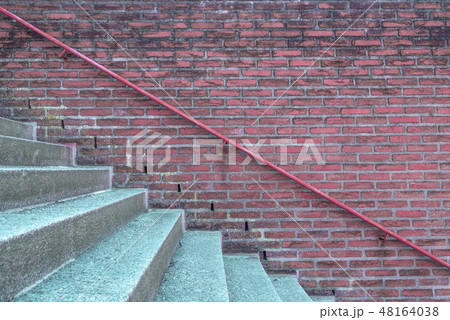 Brick wall with handrail and stairs 48164038