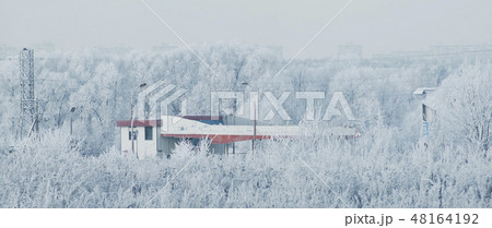 beautiful over snowy frosty landscape in the Russia. The car refueling station is in the middle of 48164192