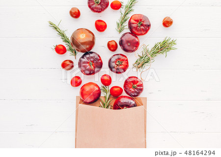 Tomatoes Mar Azul on white wooden table background Tomatoes Mar Azul on white wooden table background 48164294