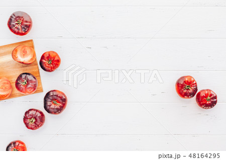 Tomatoes Mar Azul on white wooden table background 48164295