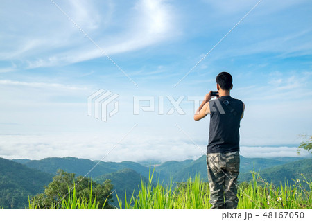 Teenager Tourist Take a Photo of Landscape. Teenager Tourist Take a Photo of Landscape. 48167050