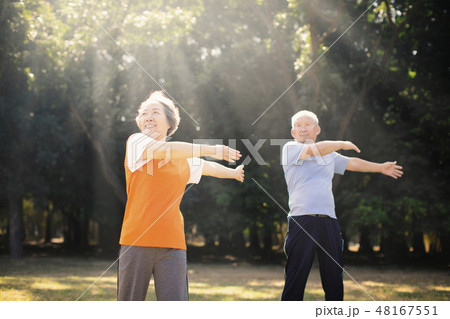 happy Senior Couple Exercising In the Park happy Senior Couple Exercising In the Park 48167551