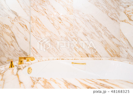 Beautiful luxury white bathtub and faucet Beautiful luxury white bathtub and faucet 48168325
