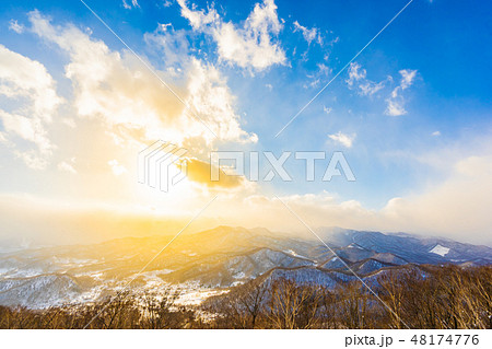 Beautiful landscape with mountain around tree in snow winter season at sunset time 48174776