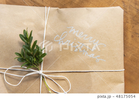 Christmas present with leaves Christmas present with leaves 48175054