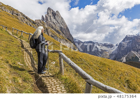Woman hiking in the Dolomites, South Tyrol, Italy 48175364