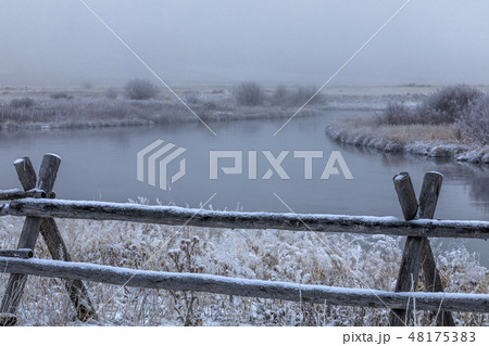 Wooden fence by river in Picabo, Idaho Wooden fence by river in Picabo, Idaho 48175383