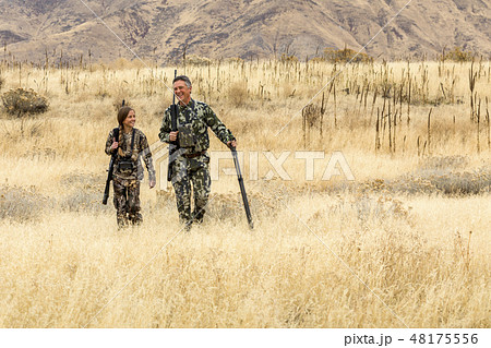 Man hunting with his granddaughter 48175556