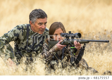Man hunting with his granddaughter 48175557