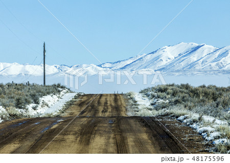 Rural road during winter in Fairfield, Idaho 48175596