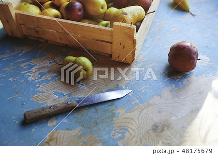 Knife by box of apples and pears Knife by box of apples and pears 48175679