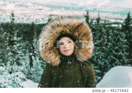 Girl with fur hood during winter 48175682