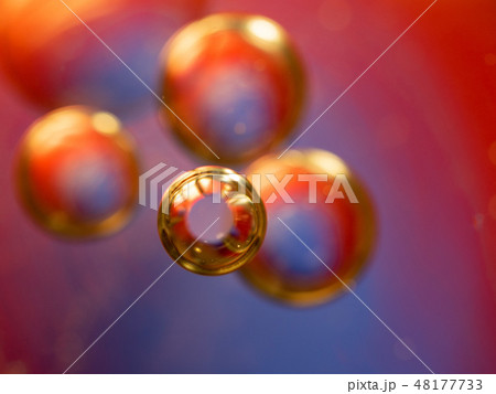Golden red spheres in abstract space. Close up 48177733