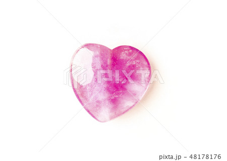 Overhead photo of a pink crystal heart on a white background with copy space Overhead photo of a pink crystal heart on a white background with copy space 48178176
