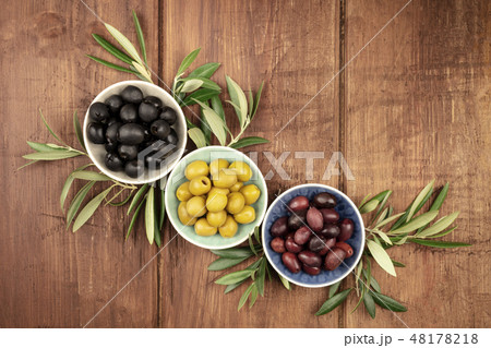 Overhead photo of various olives in bowls with copy space Overhead photo of various olives in bowls with copy space 48178218