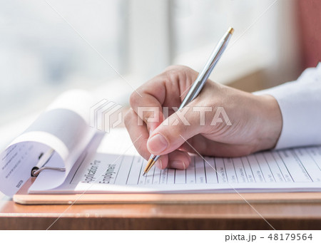 Applicant filling in company application form job Applicant filling in company application form job 48179564