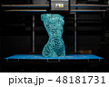 3d printer prints the model of female body, process of creating a bust of girl on 3d printer. 48181731