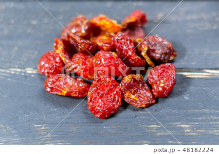 Handful of dried dogwood. Dried berry kizil. Handful of dried dogwood. Dried berry kizil. 48182224