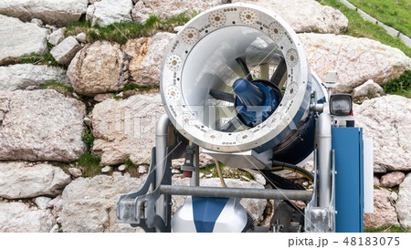 Snow cannon in a ski resort. in the Alps. Ski slope without snow during warm spring. Not season. 48183075