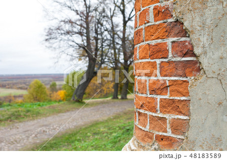 An oil column of red brick in an abandoned manor house. Rukavishnikov manor in the village of An oil column of red brick in an abandoned manor house. Rukavishnikov manor in the village of 48183589