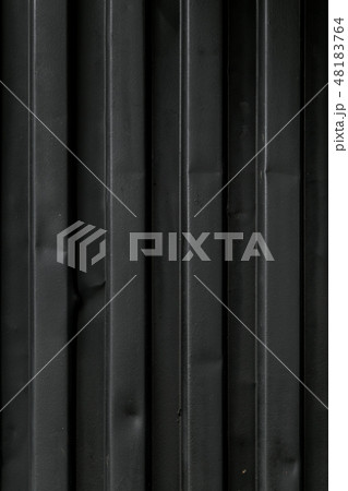 The texture of the marine metallic container is black. Close-up. Transportation of sea cargoes. 48183764