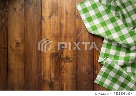 checked cloth napkin at wooden table checked cloth napkin at wooden table 48184637