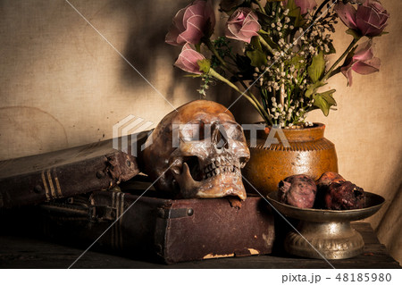 Human skull and flower vase old treasure on wooden 48185980