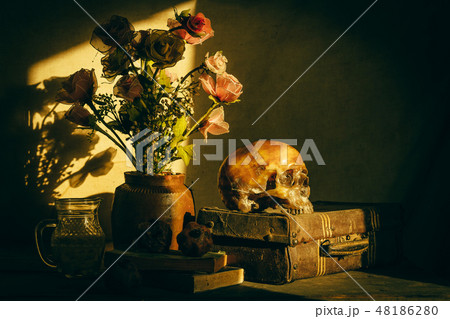 Human skull and flower vase old treasure on wooden 48186280
