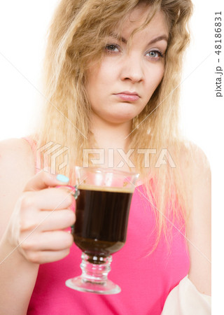 Tired woman drinking her morning coffee 48186831