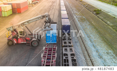 Forklift truck lifting cargo container  48187483