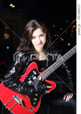 Brunette guitar player girl Brunette guitar player girl 48188027