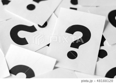 White paper cards with black question marks White paper cards with black question marks 48188120