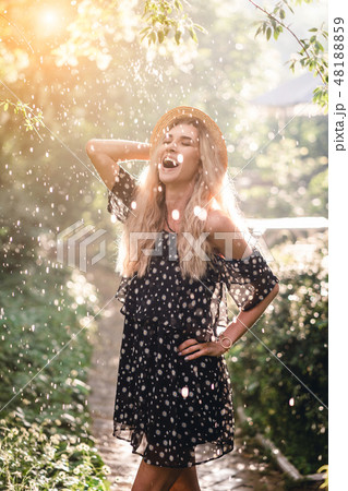 Girl in hat posing on camera 48188859