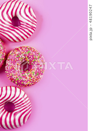 Donuts on a pink background. Donuts on a pink background. 48190247