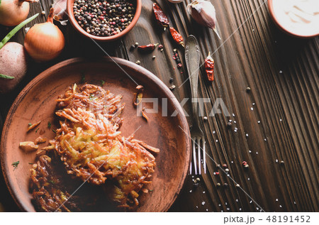 Top view Fresh homemade tasty potato pancakes Top view Fresh homemade tasty potato pancakes 48191452