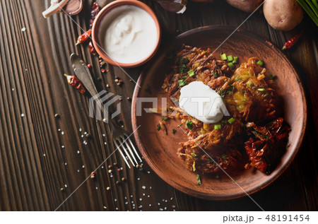 Top view at flat lay tasty potato pancakes Top view at flat lay tasty potato pancakes 48191454
