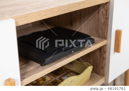 Compact DVD player in the interior on the TV Cabinet 48191761