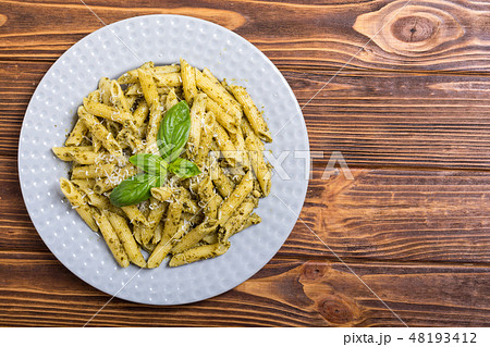 Italian penne pasta with sauce pesto Italian penne pasta with sauce pesto 48193412