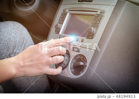Driver using touchscreen in the car 48194913