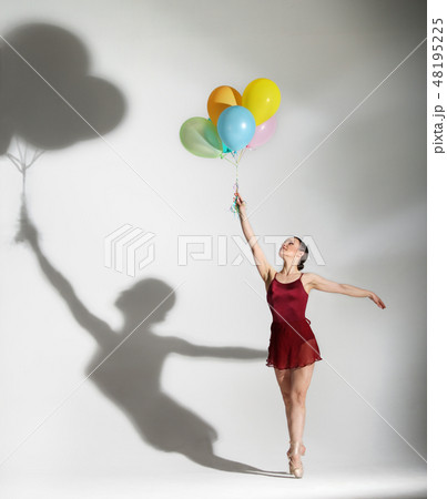 Ballet dancer posing with ballons 48195225