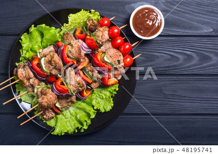 Grilled pork shish or kebab on skewers Grilled pork shish or kebab on skewers 48195741